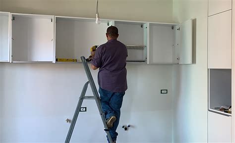 how to install kitchen cabinets on steel stud walls|hanging cabinets on steel studs.